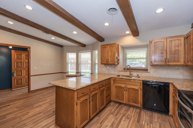 5404 While A Way Rd, Amarillo, TX 79109 - kitchen with dishwasher, a sink, a peninsula, decorative backsplash, and recessed lighting