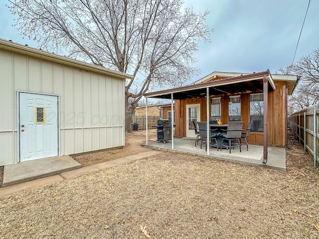 back of house with a patio