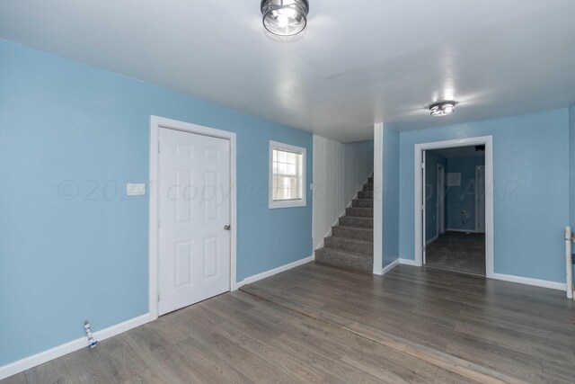 spare room featuring dark hardwood / wood-style flooring