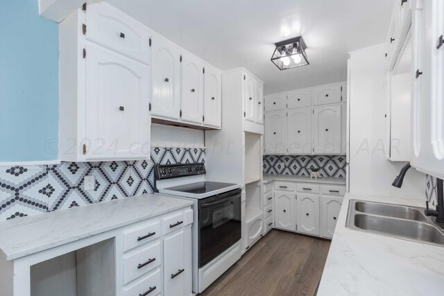 kitchen featuring white cabinetry, sink, backsplash, white range with electric cooktop, and dark wood-type flooring