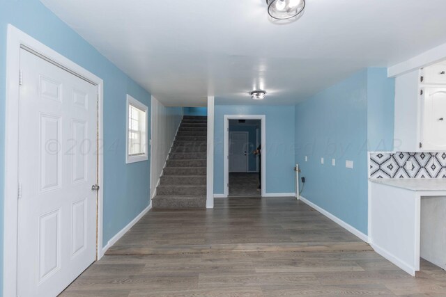 interior space with dark hardwood / wood-style floors