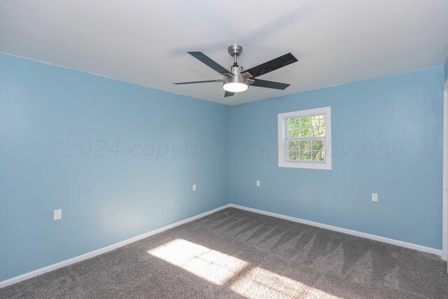 carpeted empty room with ceiling fan