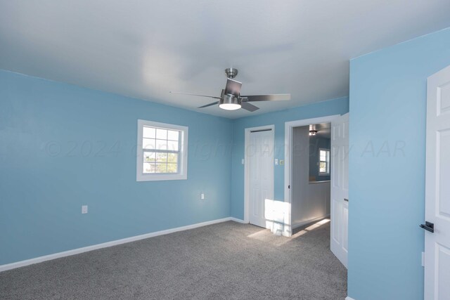 unfurnished bedroom with carpet flooring and ceiling fan