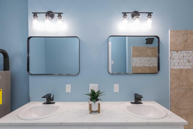 bathroom featuring walk in shower, vanity, and water heater