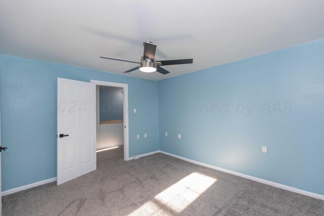 unfurnished bedroom with carpet and ceiling fan