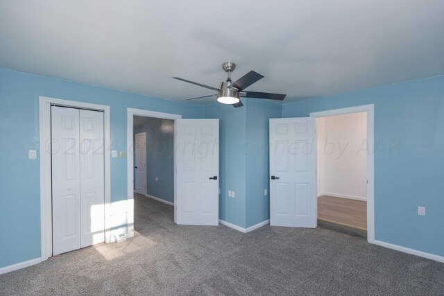 unfurnished bedroom with carpet and ceiling fan