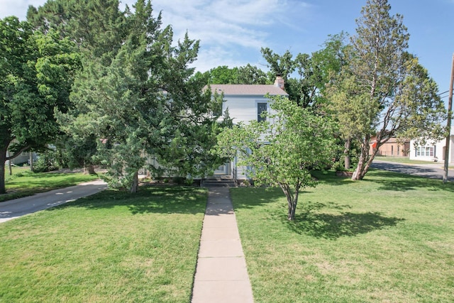 2523 5th Ave, Canyon, TX 79015 - obstructed view of property with a front lawn and a chimney