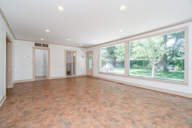 2523 5th Ave, Canyon, TX 79015 - unfurnished living room with healthy amount of natural light, recessed lighting, baseboards, and crown molding