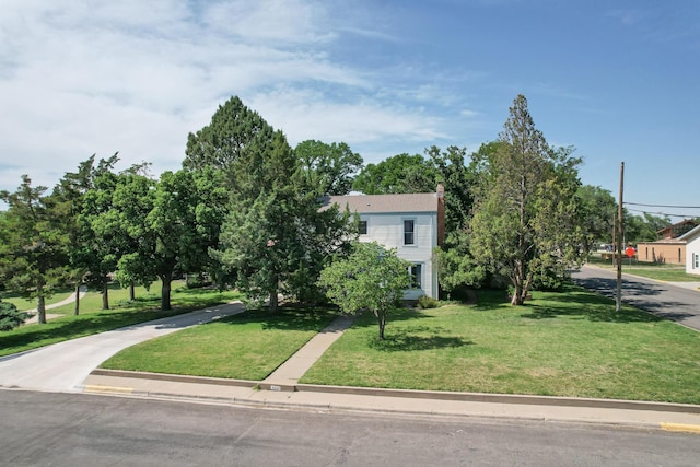 2523 5th Ave, Canyon, TX 79015 - view of front of house featuring a front lawn and a chimney