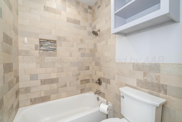 2523 5th Ave, Canyon, TX 79015 - full bathroom with tile walls, toilet, and washtub / shower combination