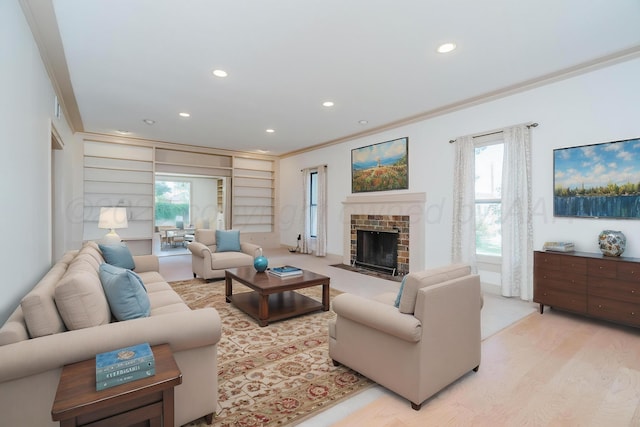 2523 5th Ave, Canyon, TX 79015 - living room with ornamental molding, recessed lighting, light wood-style flooring, a fireplace, and built in shelves