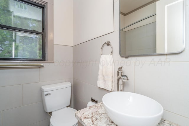 2523 5th Ave, Canyon, TX 79015 - half bath featuring toilet, vanity, and tile walls