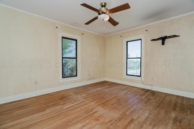 2523 5th Ave, Canyon, TX 79015 - empty room featuring wood finished floors, crown molding, baseboards, and a ceiling fan