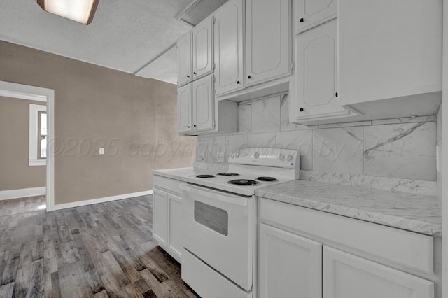 1610 N Hayes St, Amarillo, TX 79107 - kitchen featuring white cabinetry, baseboards, and electric range