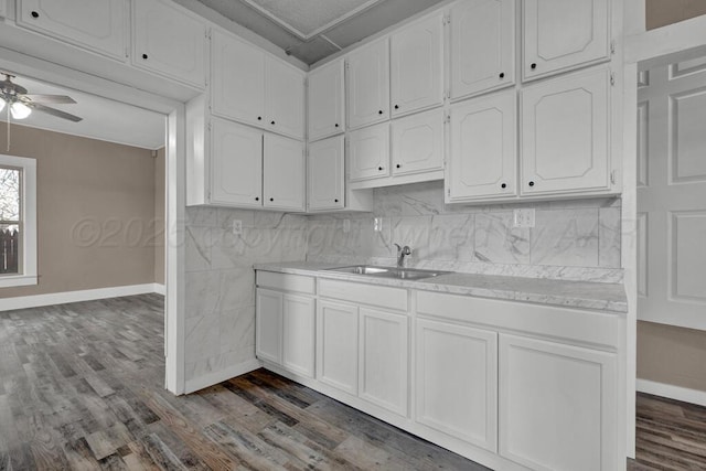 1610 N Hayes St, Amarillo, TX 79107 - kitchen with baseboards, dark wood-style floors, and a sink