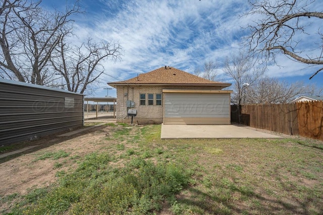 1610 N Hayes St, Amarillo, TX 79107 - back of property with a yard, a patio area, brick siding, and fence