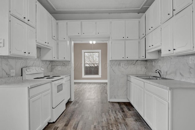 1610 N Hayes St, Amarillo, TX 79107 - kitchen featuring white cabinetry, white electric range oven, decorative backsplash, and dark wood-type flooring