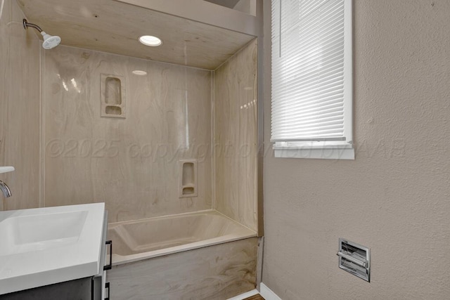 1610 N Hayes St, Amarillo, TX 79107 - bathroom featuring a combined bath / shower with marble appearance, baseboards, and vanity