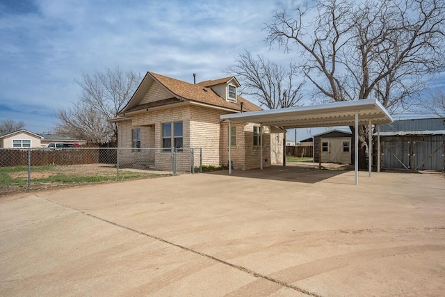 1610 N Hayes St, Amarillo, TX 79107 - exterior space featuring an outdoor structure, driveway, fence, and a carport