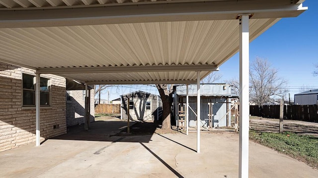 1610 N Hayes St, Amarillo, TX 79107 - view of patio featuring fence, a storage shed, and an outdoor structure