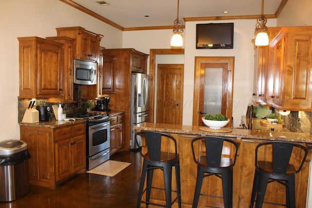 kitchen featuring stainless steel appliances, a peninsula, dark stone countertops, backsplash, and ornamental molding