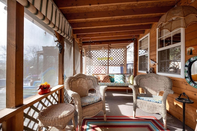 sunroom with beam ceiling