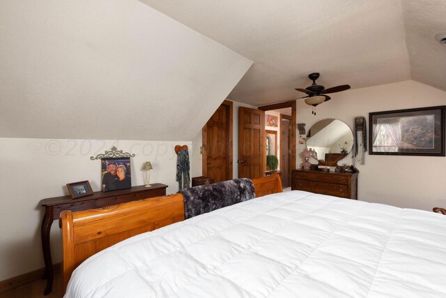 bedroom featuring ceiling fan and lofted ceiling