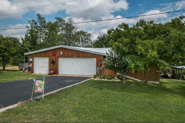 garage with a lawn