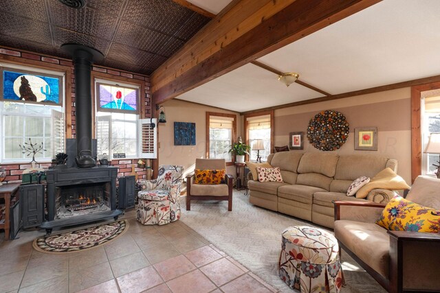 tiled living room with a wealth of natural light and beamed ceiling