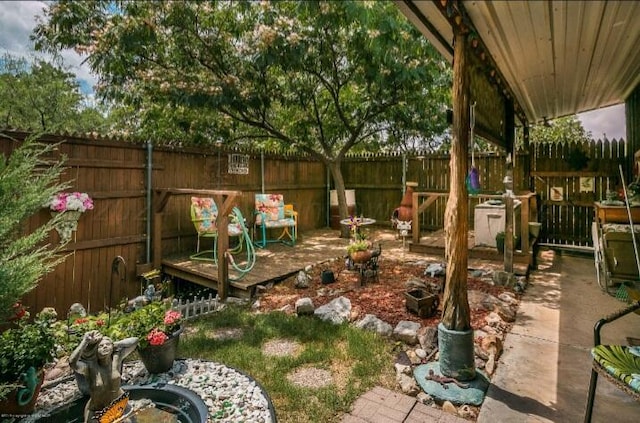 view of yard featuring a patio area and a deck