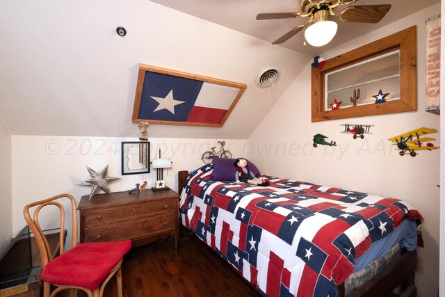 bedroom with ceiling fan, dark hardwood / wood-style floors, and lofted ceiling