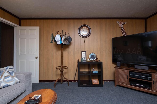 living room featuring a textured ceiling, dark colored carpet, and wooden walls