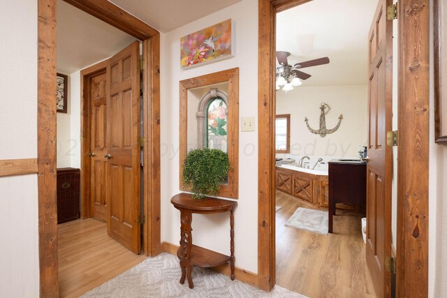 hallway with light wood-type flooring