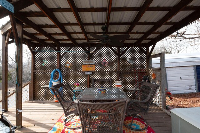 wooden deck featuring ceiling fan