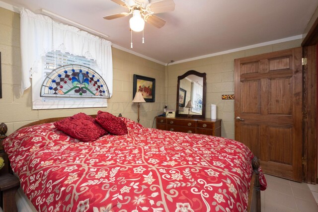 bedroom with ornamental molding and ceiling fan