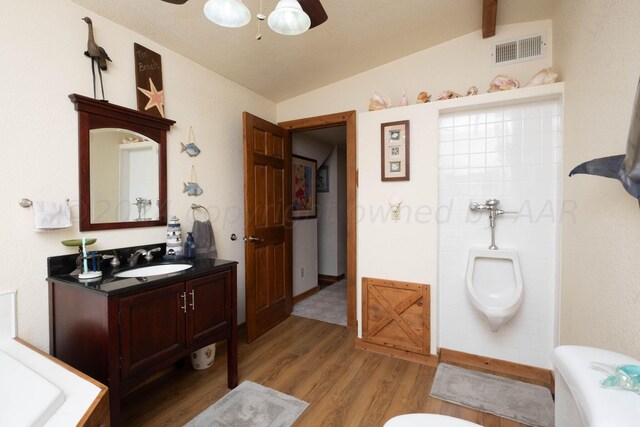 bathroom featuring lofted ceiling with beams, hardwood / wood-style floors, ceiling fan, and vanity