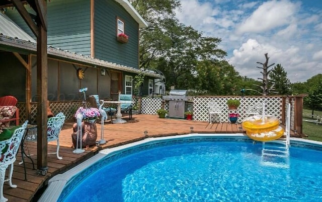 view of pool with a deck