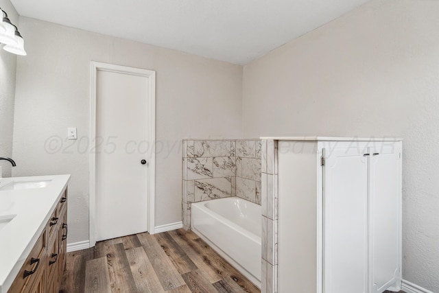 517 Whittier St, Hereford, TX 79045 - bathroom with wood finished floors, a bath, and double vanity
