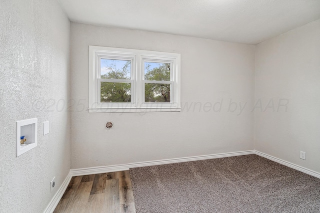 517 Whittier St, Hereford, TX 79045 - spare room featuring baseboards and wood finished floors