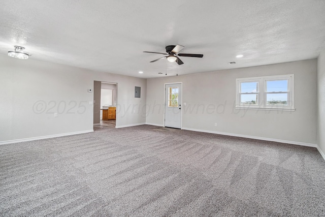 517 Whittier St, Hereford, TX 79045 - carpeted spare room with a ceiling fan, a textured ceiling, recessed lighting, and electric panel