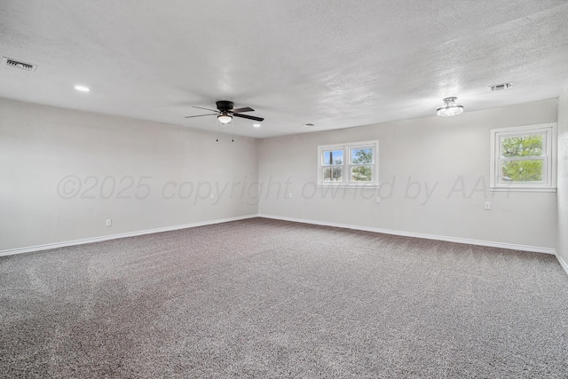 517 Whittier St, Hereford, TX 79045 - empty room featuring a ceiling fan, healthy amount of natural light, carpet, a textured ceiling, and recessed lighting