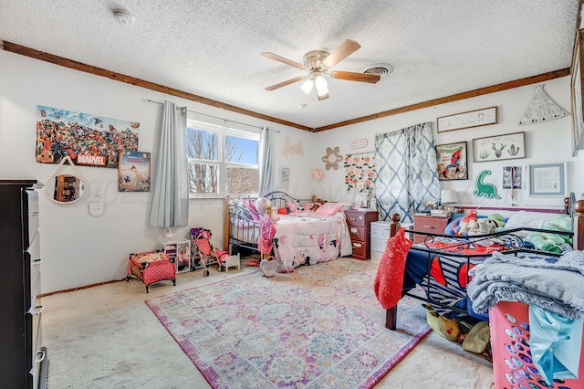carpeted bedroom with visible vents, a ceiling fan, ornamental molding, baseboards, and a textured ceiling