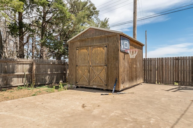 view of shed featuring a fenced backyard