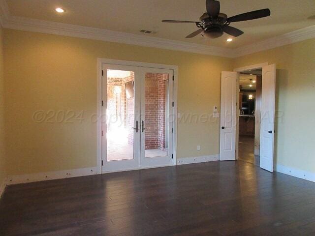 unfurnished room with dark hardwood / wood-style flooring, crown molding, and french doors