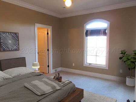 hall featuring ornamental molding and light carpet