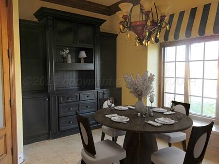 unfurnished dining area with coffered ceiling, dark wood-type flooring, a healthy amount of sunlight, and ornamental molding