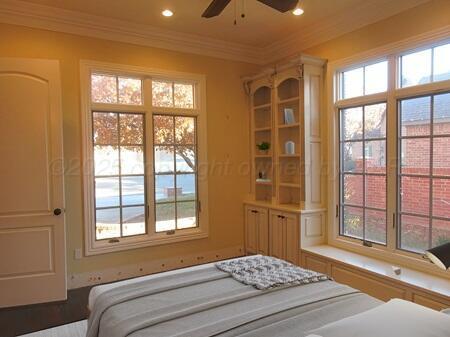 bathroom with sink, backsplash, tile patterned floors, and a bathing tub