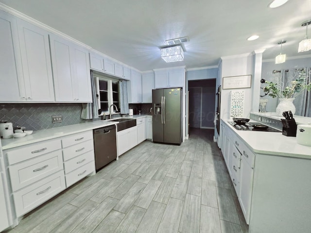 kitchen with sink, light hardwood / wood-style flooring, pendant lighting, white cabinets, and black appliances