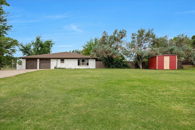 4400 Gem Lake Rd, Amarillo, TX 79106 - view of yard with driveway, a garage, and a storage shed