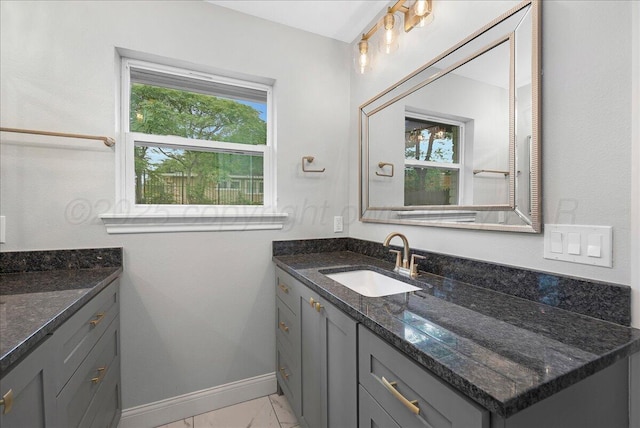 4400 Gem Lake Rd, Amarillo, TX 79106 - bathroom with marble look tile flooring and vanity